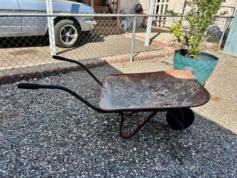 Old rustic wheel barrel