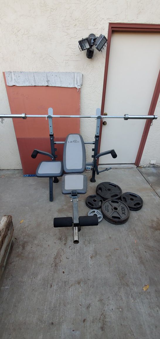 Bench press with attachments with 240lb weight set