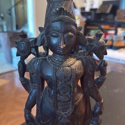 checkout Tall Asian wooden statue of a godess with 4 arms