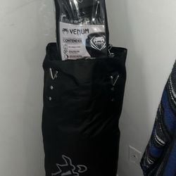 Punching Bag w Mounts (never used) & Gloves (used lightly)
