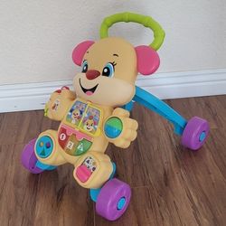 Practically New Baby Walker With Music And Lights ( Used Once). Price Firm!