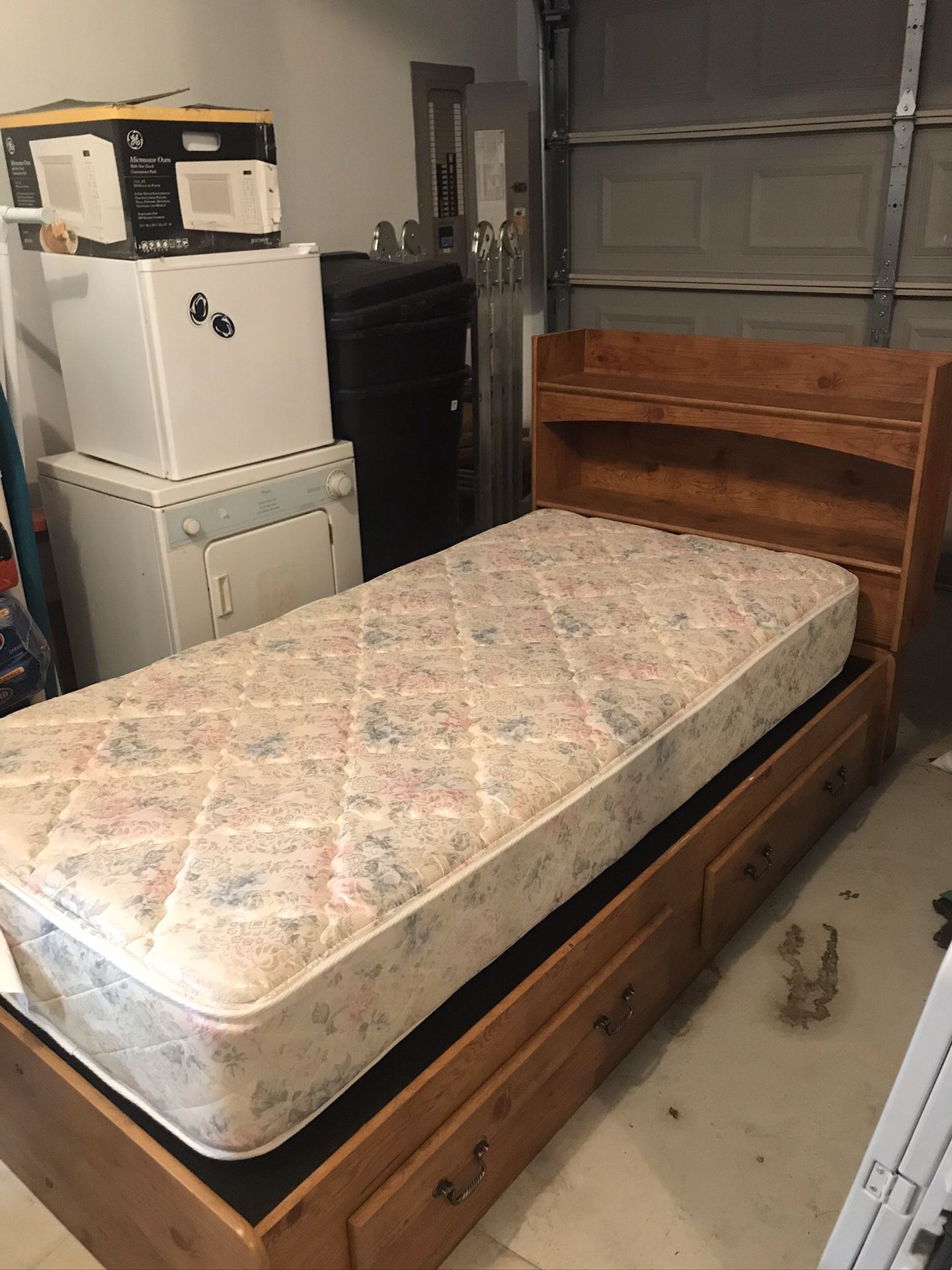 Twin Bed with two drawers and book shelf headboard