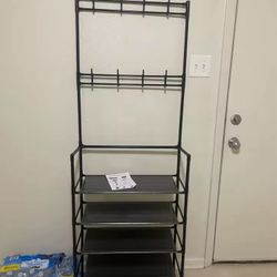 A clothes hanger and shoe rack at the entrance, used for storing shoes, clothes, jackets, hats, bags, and more