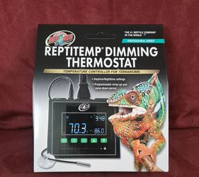 Zoo Med ReptiTemp Dimming Thermostat (Model RT-600P), a digital temperature controller designed to regulate heat sources in reptile terrariums.