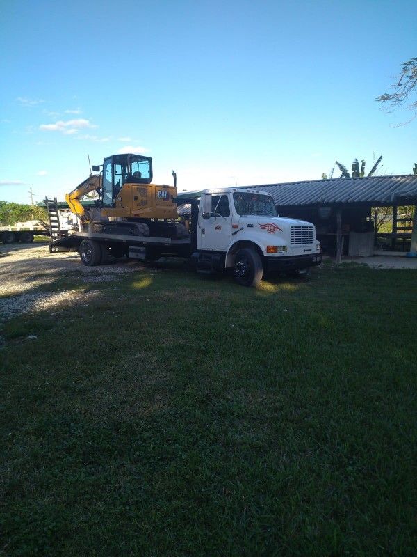 Turnkey 2009 Peterbilt Truck With Flatbed, Caterpillar Excavator And Bobcat