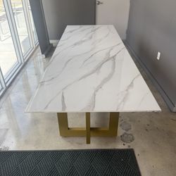 Calacata porcelain table with golden iron base.