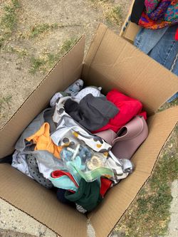 Box of baby clothes