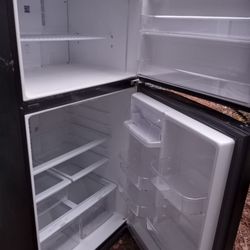Black refrigerator $250 and white refrigerator $150