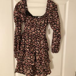 Black floral mini dress with pink accents, featuring a sweetheart neckline and flowy sleeves Size XS
