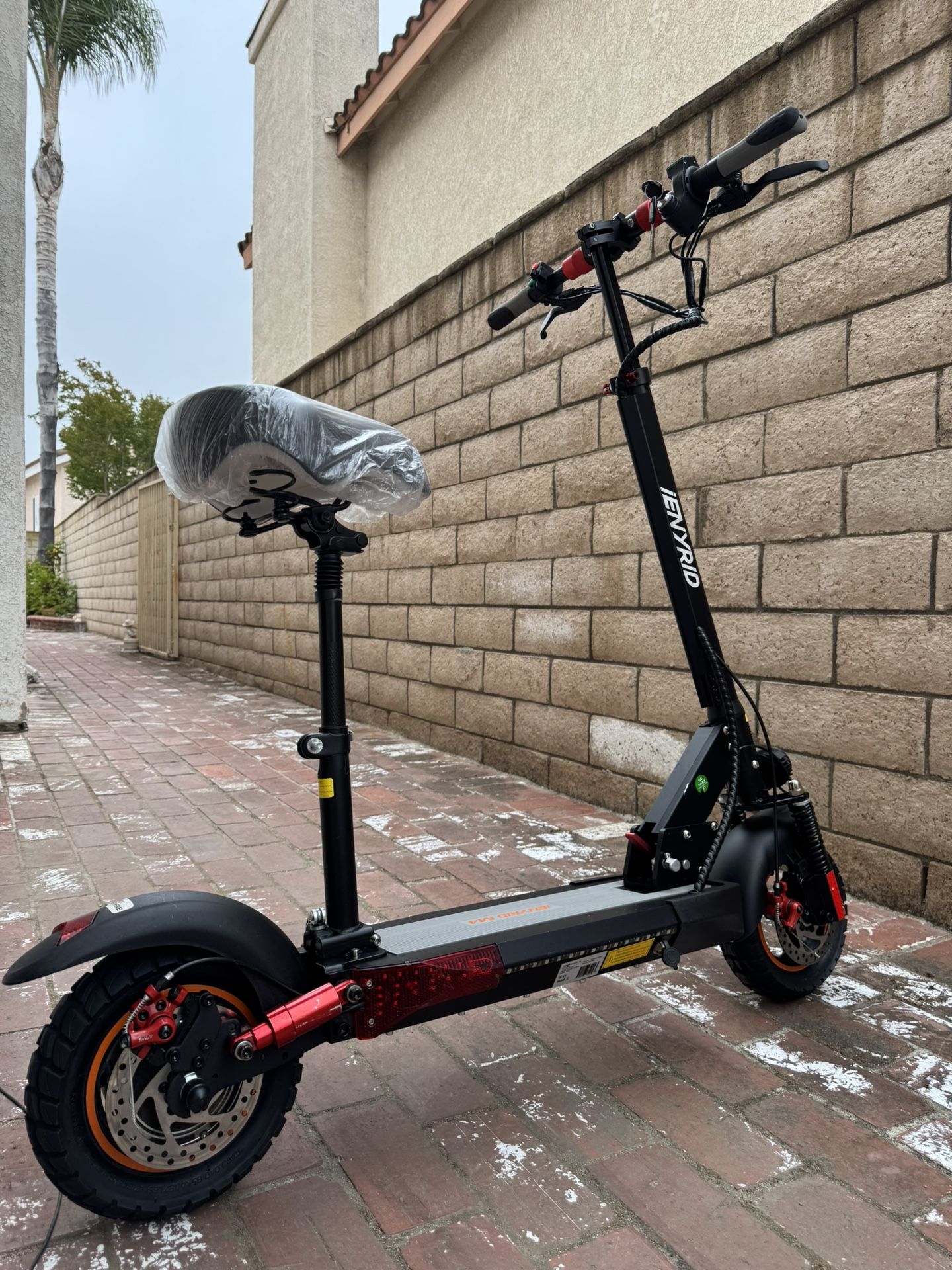 Double shock-absorbing electric scooter