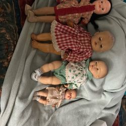 Four Old Dolls