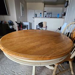 Dinning rm / kitchen table .  Cream and tan in color