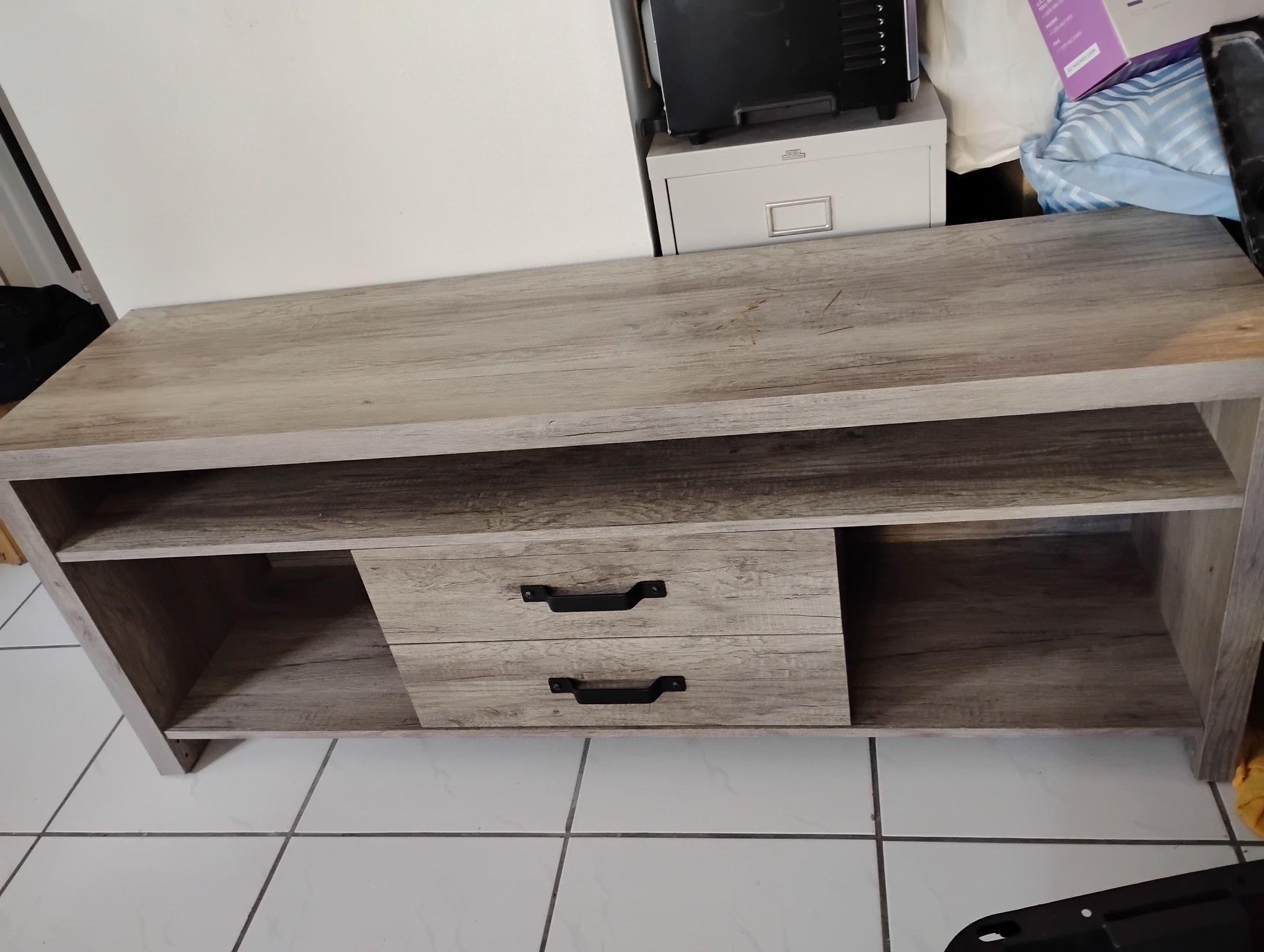 Tv Stand . Long 58” , Width 16” and Height 23” . Good Condition.