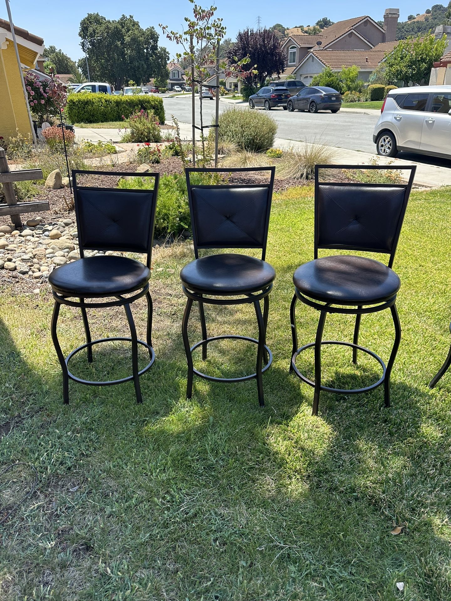 Three Swivel Bar Stools With Back