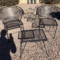 Two Metal Chairs And Small Stand