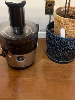 Juicer with plant and plant base