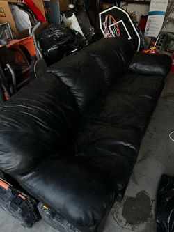 Leather couch/ folding bed