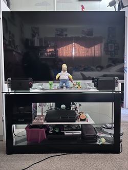 55 LG TV with stand and PS3 with games.
