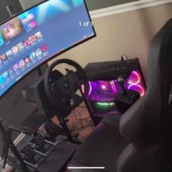 Logitech GPro racing simulator with pedals and Odyssey G9 neo curved gaming monitor