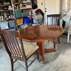 29” H x (48”/ 52” L) beautiful hexagon wood kitchen table $50 With two solid wood chairs $50 