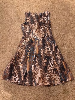 Jennifer Lopez Size 10 dress. Fun animal print, scuba type fabric. Super comfortable, great condition. Located in Murray cash/Venmo. Venmo to hold