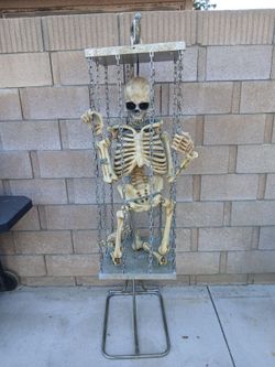 Caged skeleton with stand