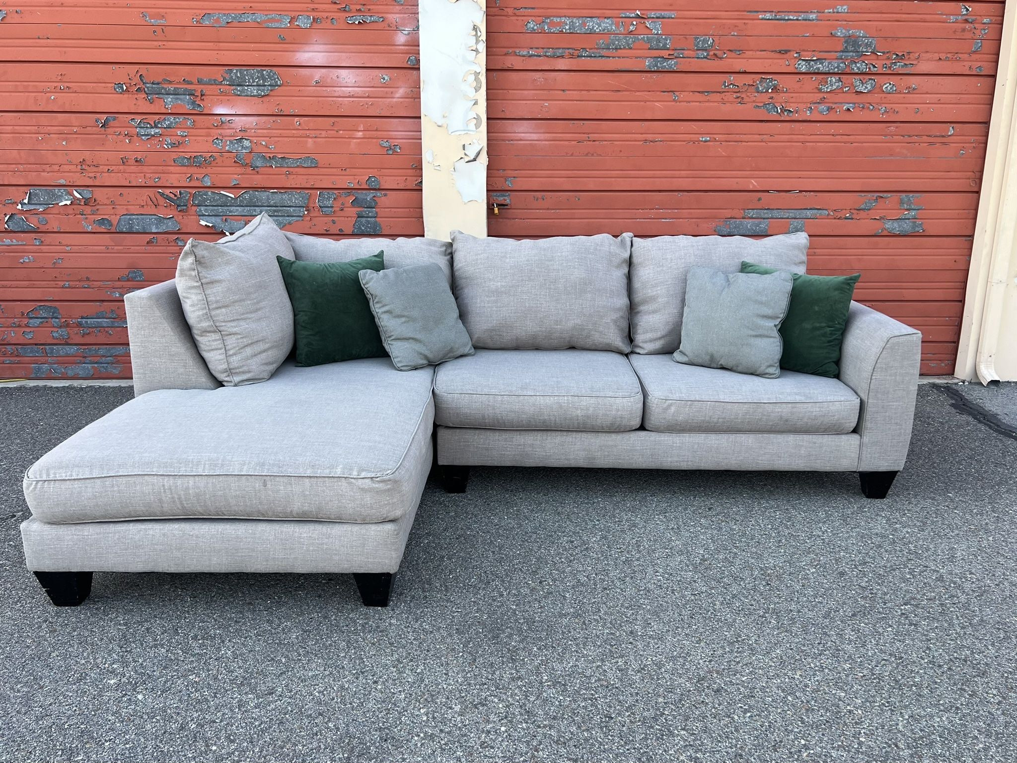 Gray sectional sofa couch with left facing chaise