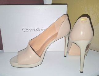 Calvin Klein Nude Peep Toe Stilettos with a platform sole             peep toe stilettos with a platform sole.            in peep toe stilettos with a