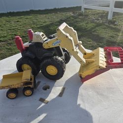 Two Toy Dump Trucks
