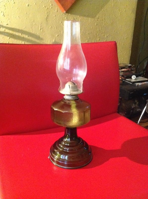 Antique green glass oil lamp