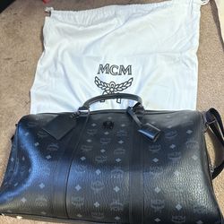 MCM black leather duffel bag #luxurytravel