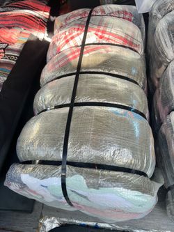 100 lbs of sweaters