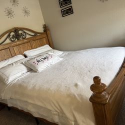 Bed, mattress, and two nightstands—one on each side—in California King size.