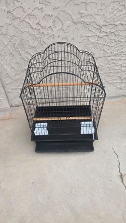 Nice bird cage with extras 33 tall 24 inch wide