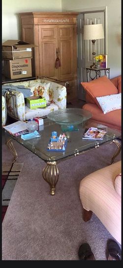 Unique glass top coffee table w/solid brass base