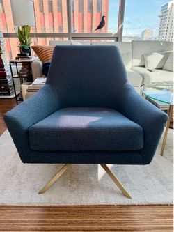 Article mid-century inspired swivel lounge chair