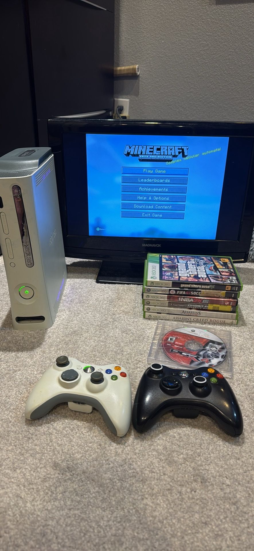 Xbox 360 with 2 controllers 7 physical and 2 preloaded games