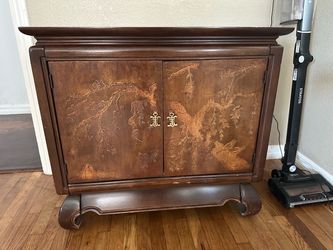 Asian-Style Wood Cabinet with Carved Doors