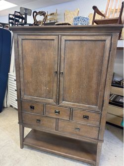 American Drew Park Studio bar cabinet featuring a weathered taupe finish with a grey wash- 46” x 17.5 x 68” - Retail: $1295