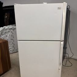 white Whirlpool top-freezer refrigerato