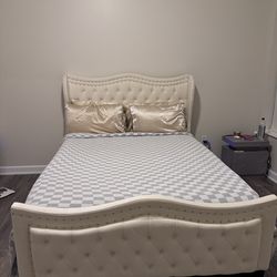 Queen size mattress and bed frame.