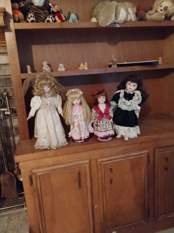 Four Old Dolls