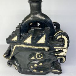 The Moche Crawling Feline. Peruvian Decorative Ceramic.    The Moche Crawling Feline is a specific stirrup spout vessel dating from 100—800 CE. This M