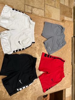 Four Nike medium (boys) shorts