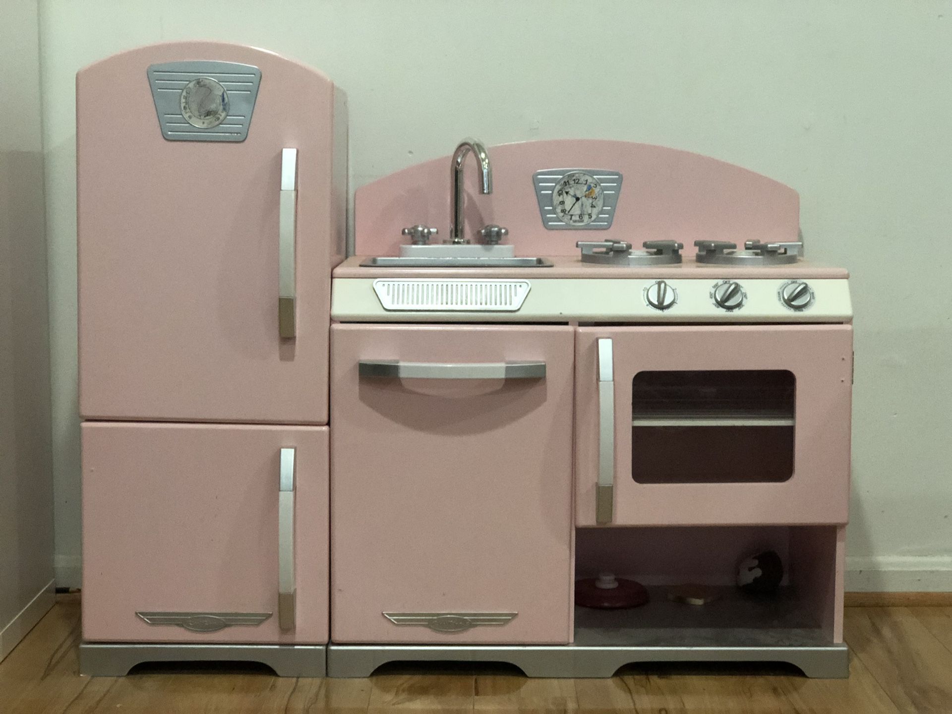 KidKraft pink wooden kitchen with supplies