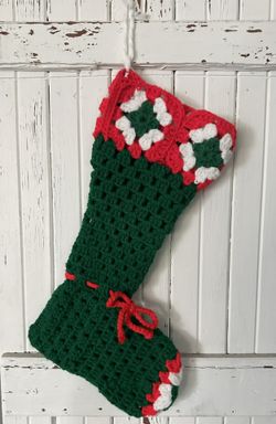 Vintage handmade crocheted green granny square Christmas stocking. Granny squares on the top and the toe.  15” long. Loop for hanging. 