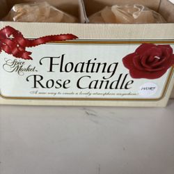  a box of Merkel Amdore floating rose candles. 16 count