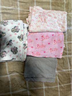 Baby girl sleepers and towel, blankets