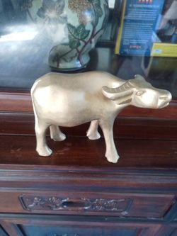 Wooden hand carved cow