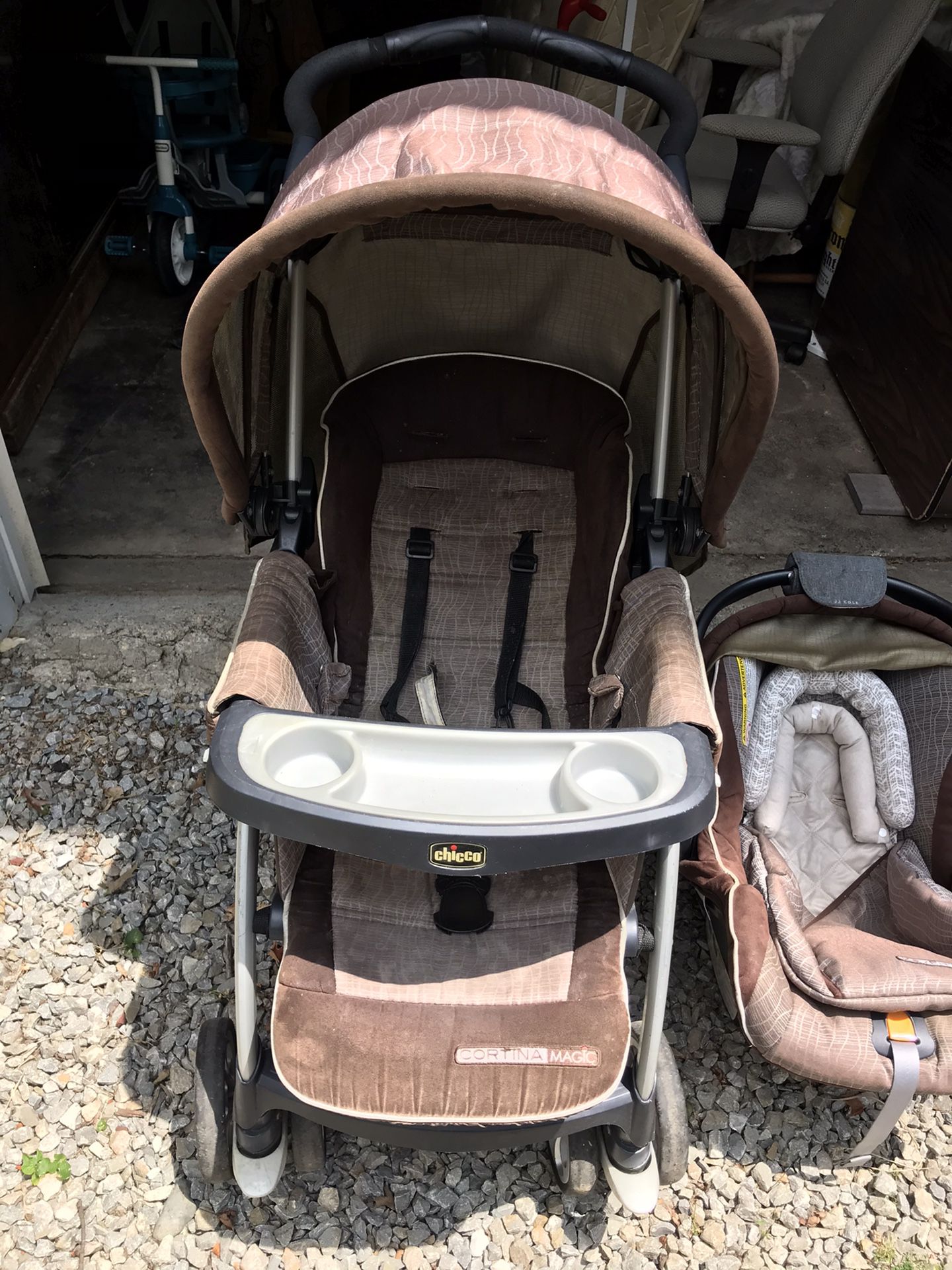 Chicco stroller, infant car seat carrier and 2 bases. Includes JJ Cole hand grip cushion and head support for infant.